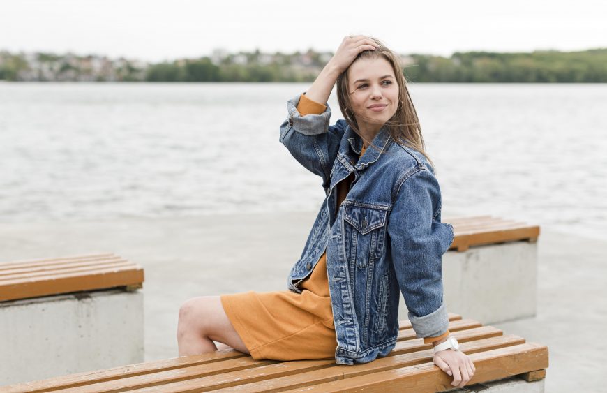 woman-sitting-bench-seaside